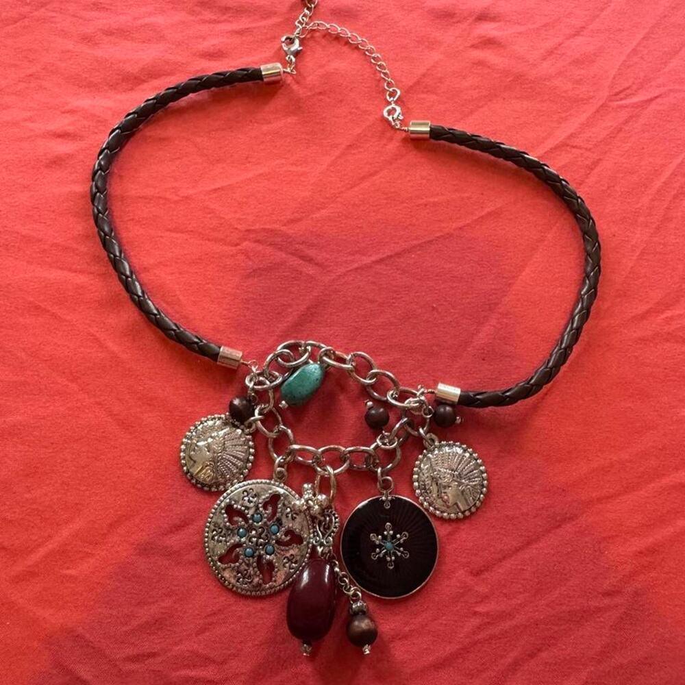 Brown braided leather necklace with silver toned charms and colorful beads